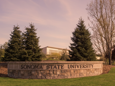 Image of a sign on a lawn that says "Sonoma State University"